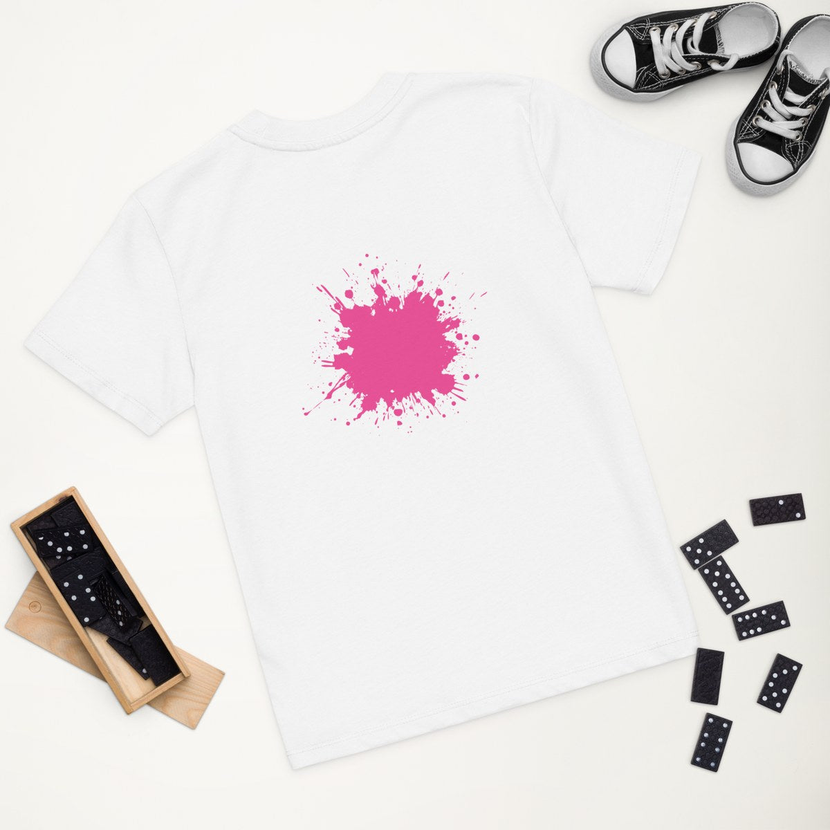 White organic kids' T-shirt with the Low Pink Splash design, styled flat lay