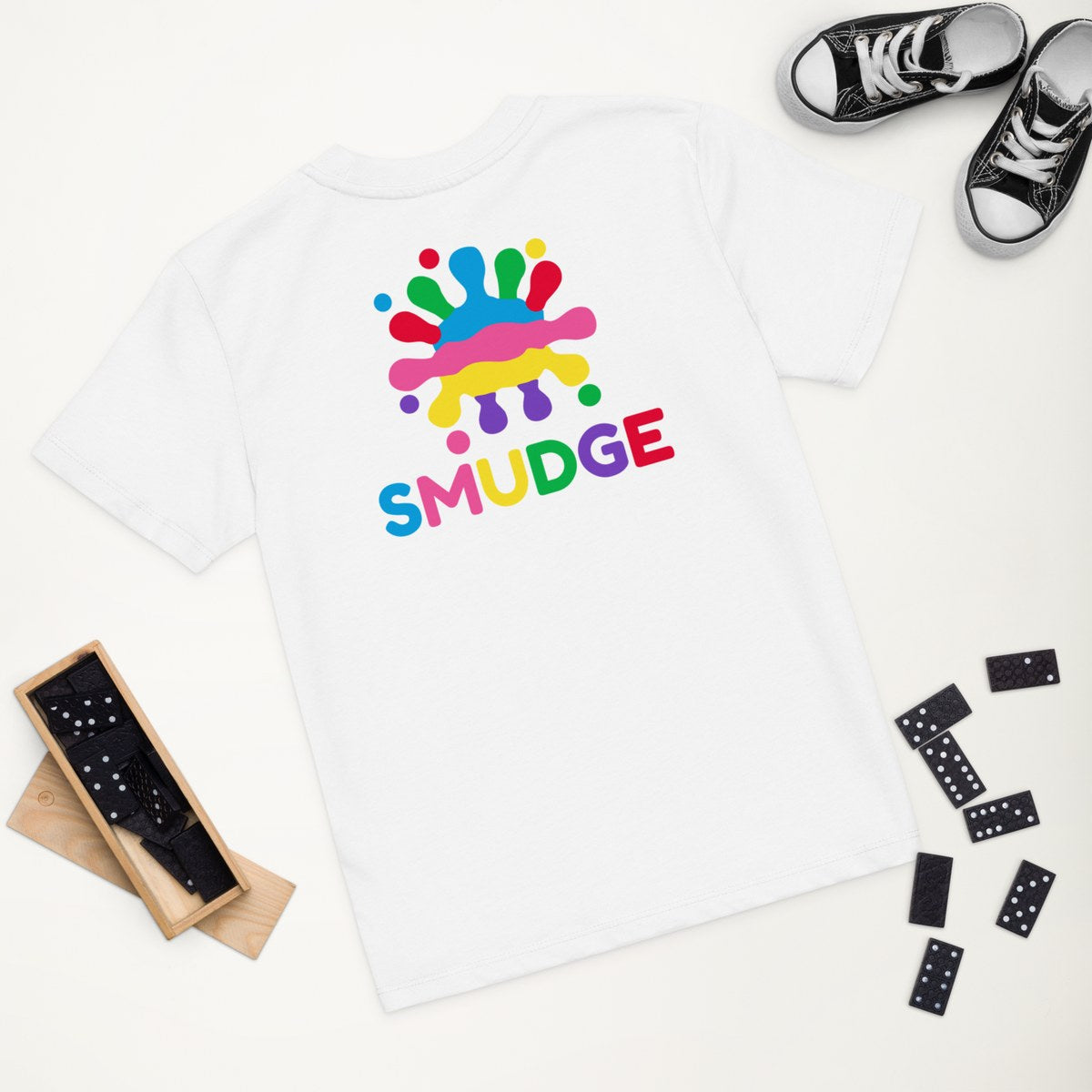 White organic kids' T-shirt with the Big Back Lockup design, styled flat lay