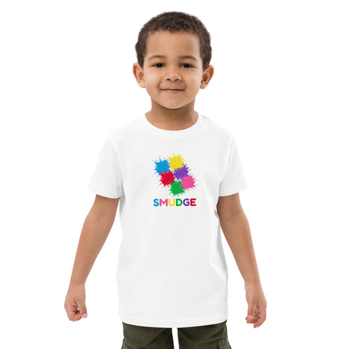 Child wearing the white organic T-shirt with paint splats and the SMUDGE wordmark on the front