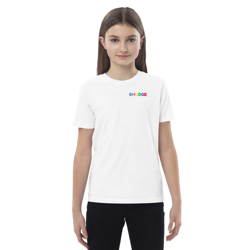 Child wearing the white organic SMUDGE T-shirt, small wordmark on the left chest