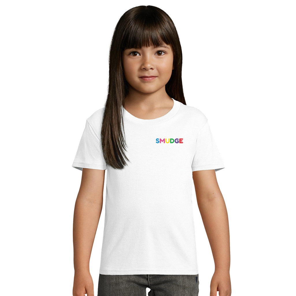 Girl wearing the white organic kids' T-shirt with a small SMUDGE wordmark at the top right of the chest