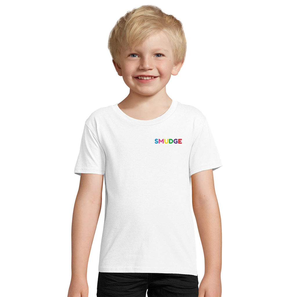 Boy wearing the white organic kids' T-shirt with a small SMUDGE wordmark at the top right of the chest