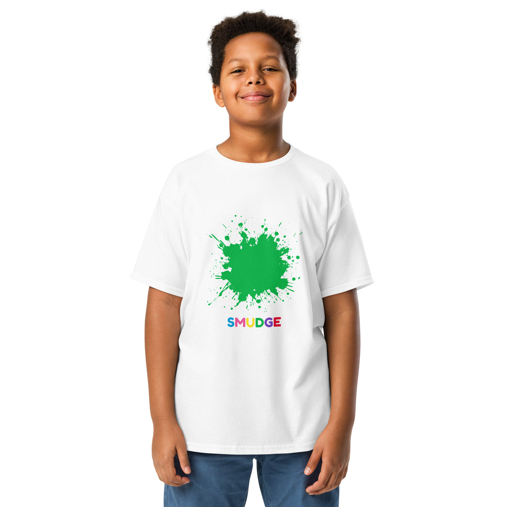 Boy wearing a white youth T-shirt with a green paint splat and SMUDGE wordmark on the chest