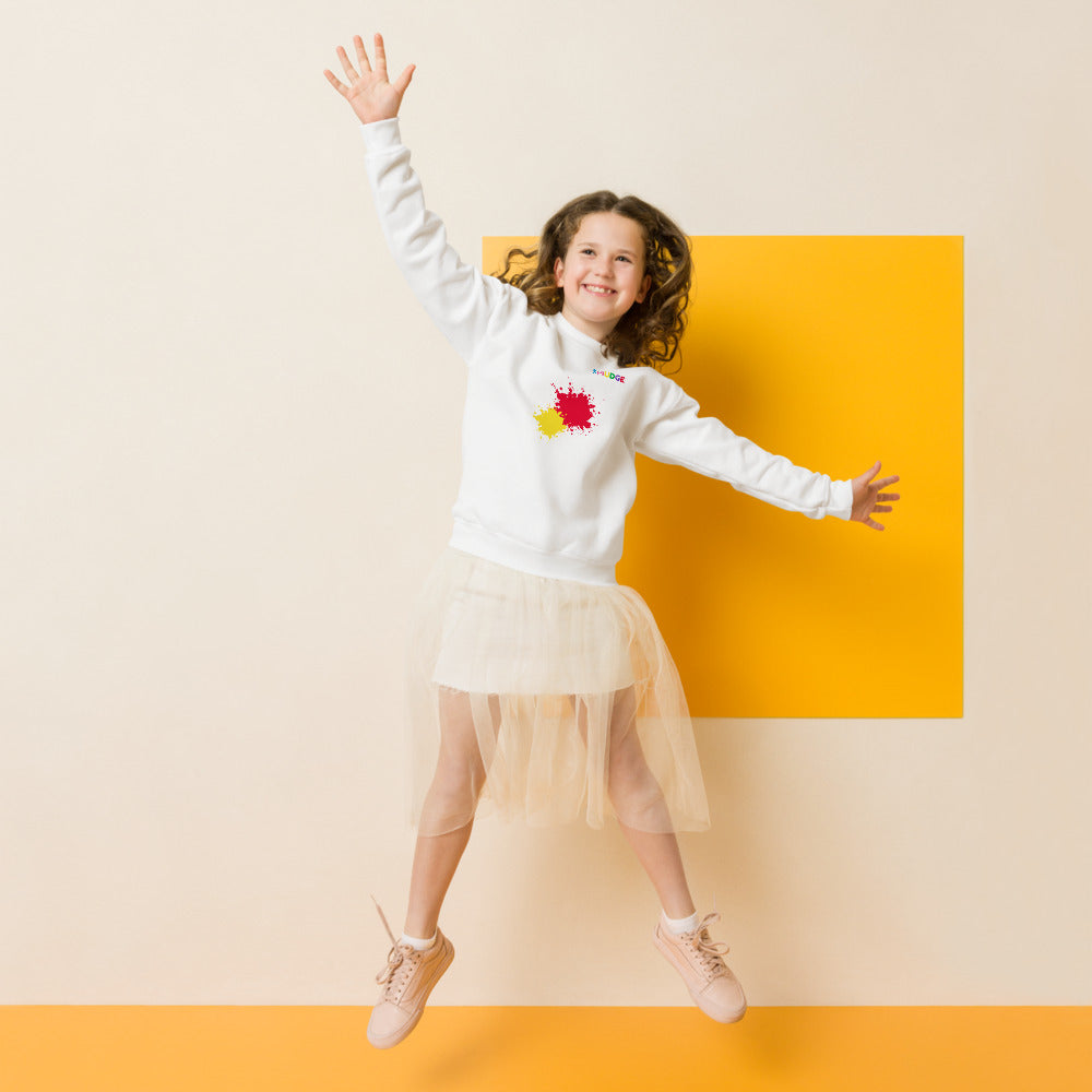 Child wearing a white SMUDGE youth sweatshirt with the Red and Yellow Front Pair design, front view, studio backdrop